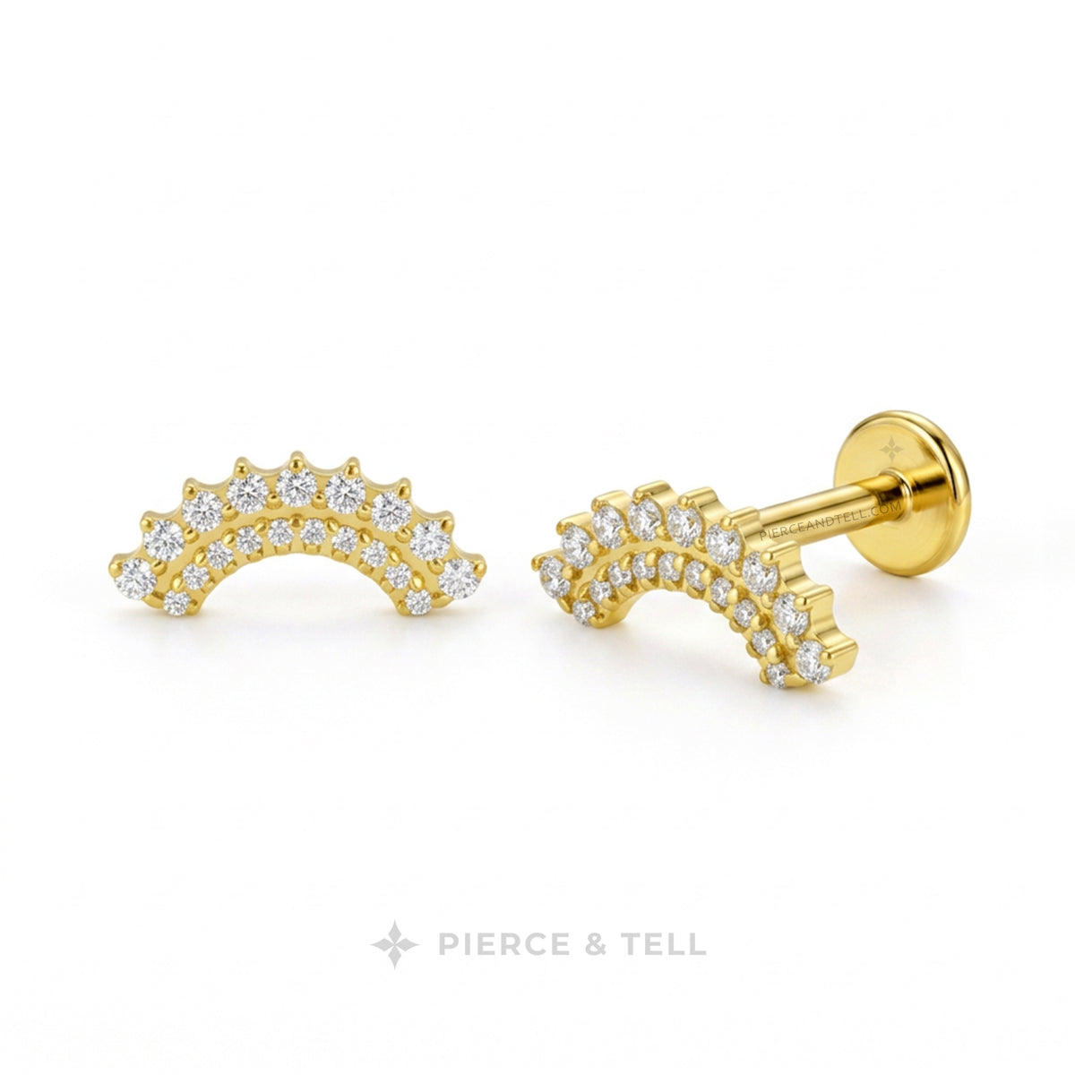 A pair of gold crescent moon stud earrings set with clear pavé diamonds, shown from both front and side angles on a white background with the PIERCE & TELL logo at the bottom.