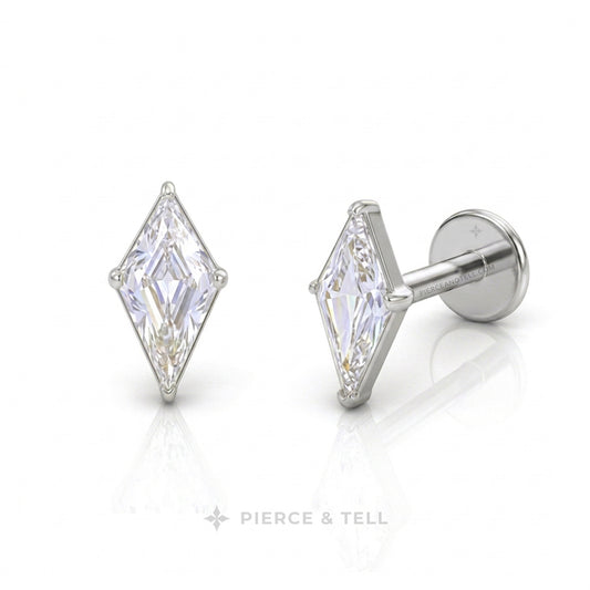 A pair of silver-toned diamond-shaped stud earrings with marquise-cut clear gemstones, shown from front and side angles on a white reflective surface with the PIERCE & TELL logo at the bottom.