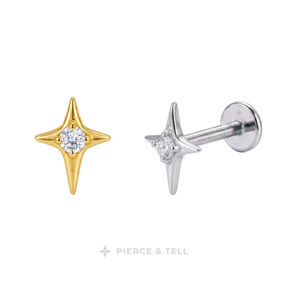Two star-shaped stud earrings with round-cut clear gemstones, shown on a white background. One earring is yellow gold, and the other is silver with a post and flat back.