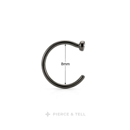 A single black metal C-shaped piercing ring shown on a white background with a vertical dimension marker indicating 8mm width. The brand name 'PIERCE & TELL' appears at the bottom.