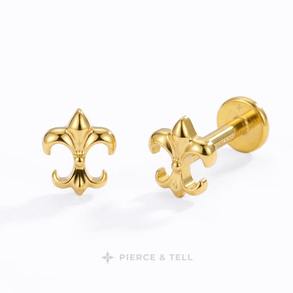 Two small metallic stud earrings on a white background: one gold-tone cluster of three rounded beads and one silver-tone cluster of three rounded beads with a barbell backing. The brand name PIERCE & TELL appears below.
