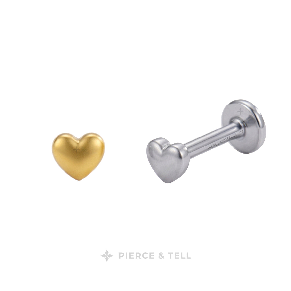 Two heart-shaped labret ear piercings shown on a plain white background: one in polished yellow gold and one in polished silver. The brand name 'PIERCE & TELL' is printed at the bottom.