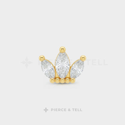 Gold and diamond earring on a white background with 'Pierce & Tell' branding.