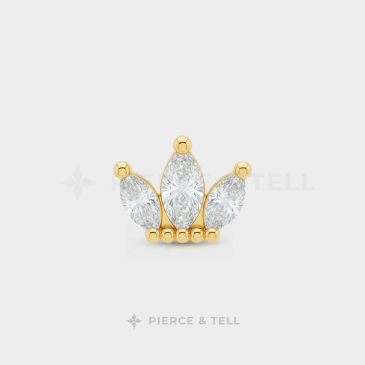 Gold and diamond earring on a white background with 'Pierce & Tell' branding.