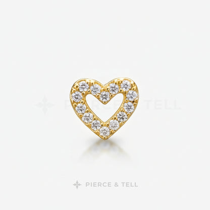 Gold and silver heart-shaped earring with diamonds on a white background, branded 'Pierce & Tell'.