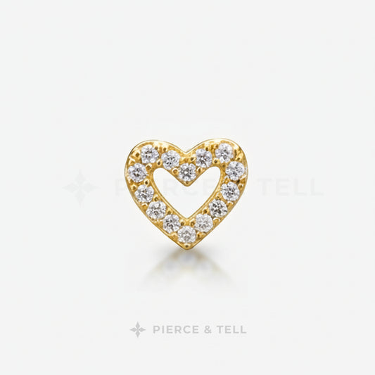 Gold and silver heart-shaped earring with diamonds on a white background, branded 'Pierce & Tell'.