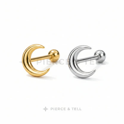 Gold and silver moon-shaped earrings on a light gray background with 'Pierce & Tell' branding.